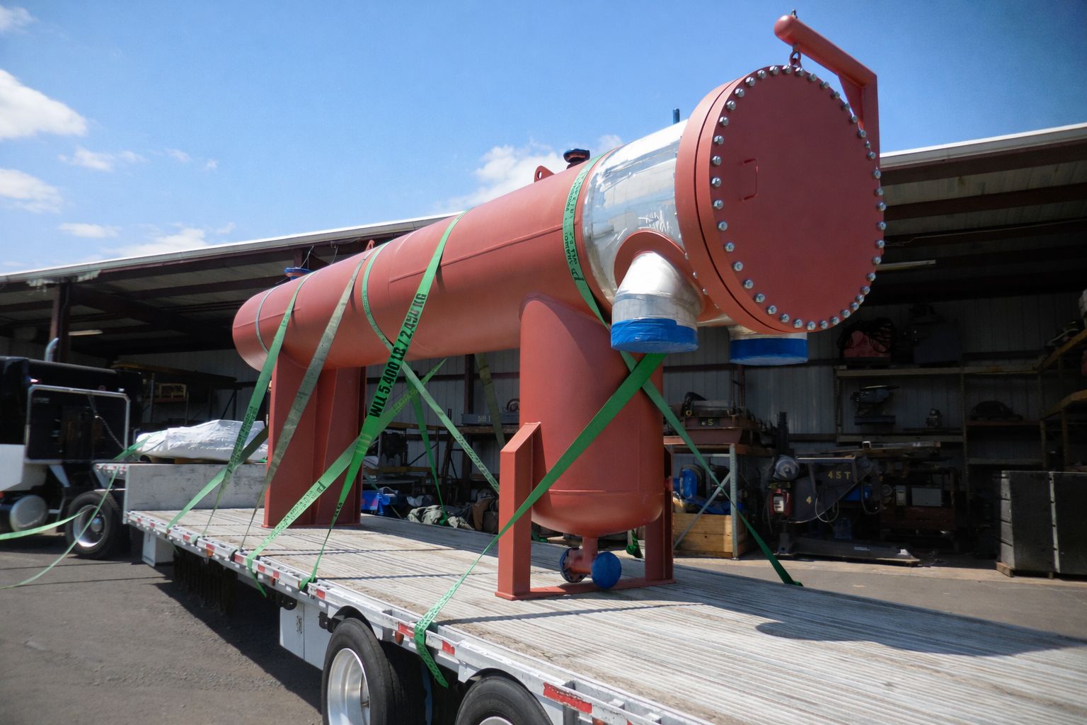 Custom Harris Thermal fry oil heater strapped to a flatbed trailer and prepared for shipment