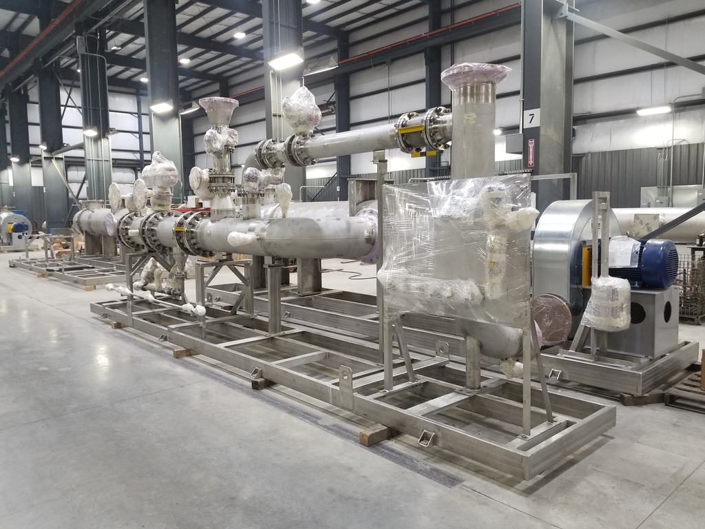 Skid-mounted stainless steel process piping and equipment modules