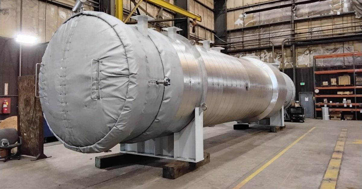 Large insulated process vessel on structural supports in the Harris Thermal shop